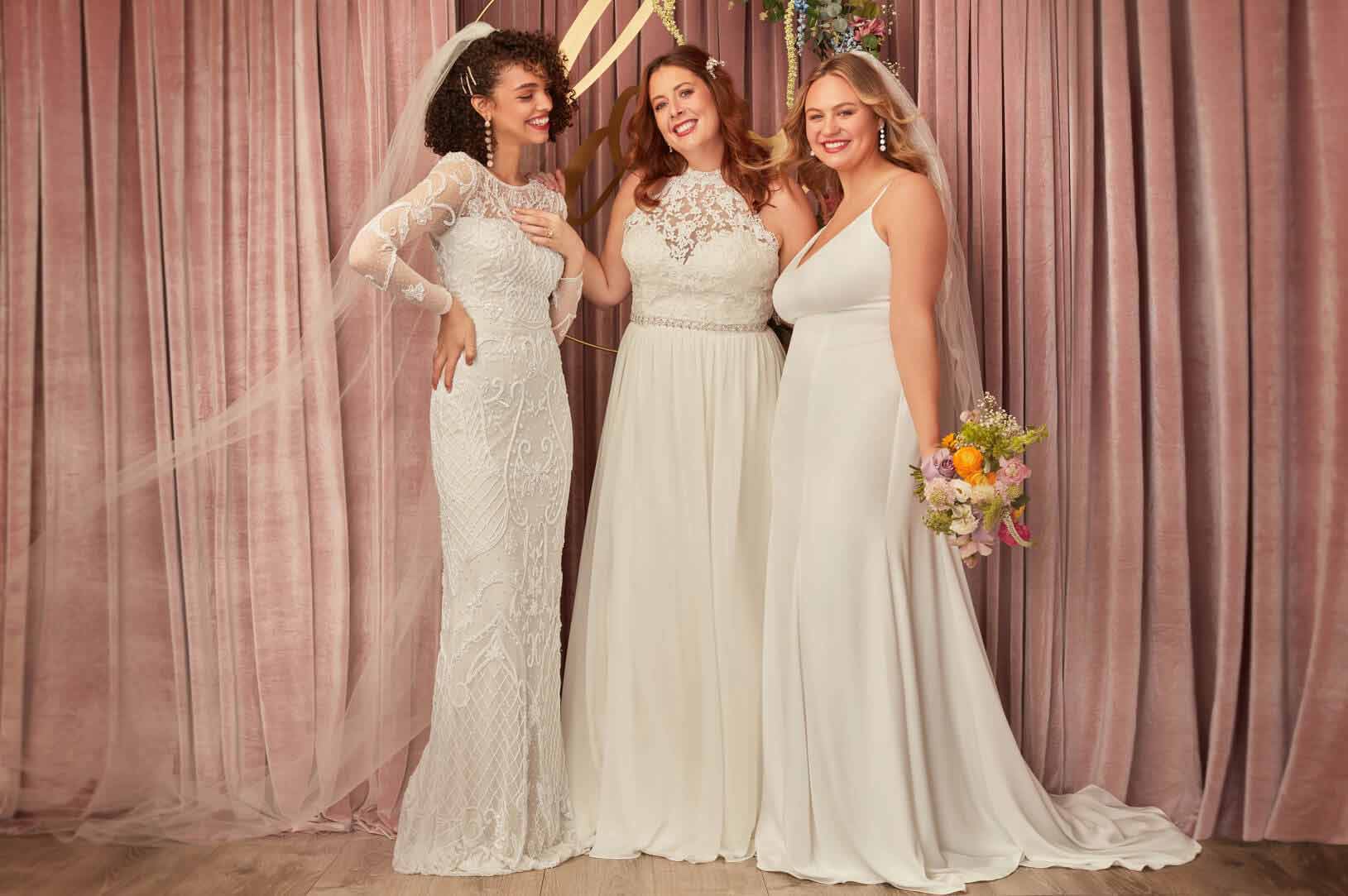 3 brides in different wedding dresses standing next to each other