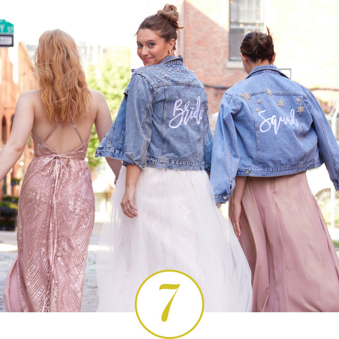 bride and her bridesmaids wearing bride squad jean jackets