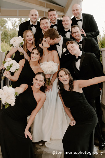 bridal party in black bridesmaid dresses @toni.marie.photography