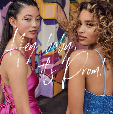 hey baby, it's prom two girls in prom dresses looking over their shoulders