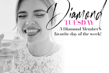 bride smiling as she sips champagne promoting diamond tuesday a diamond member's favorite day of the week!