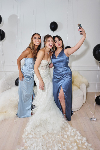 bride with her two bridesmaids taking a selfie