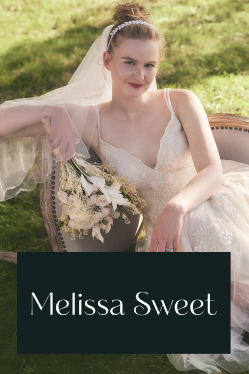 bride in melissa sweet sitting against a chair on the ground promoting the melissa sweet brand