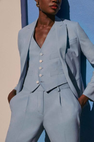 woman in blue Indochino suit