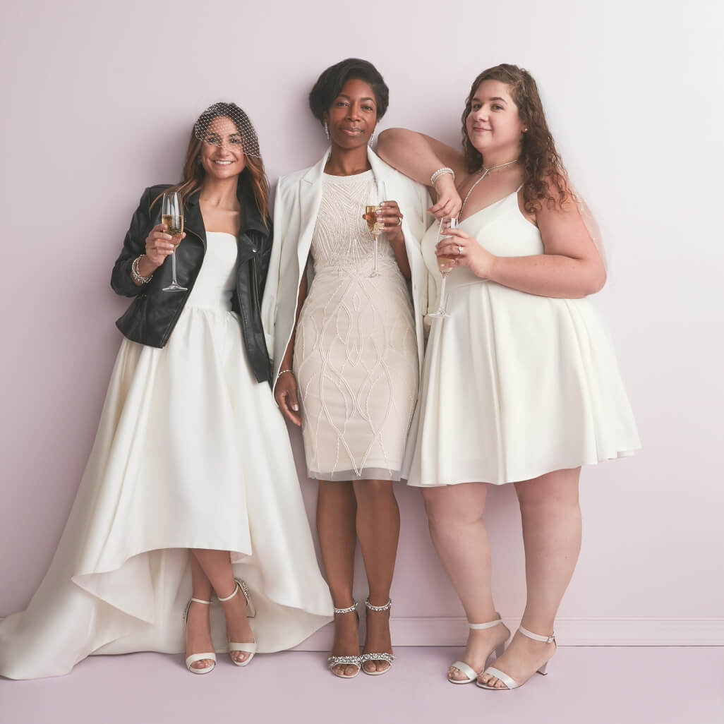 3 brides wearing different wedding dresses standing next to each other