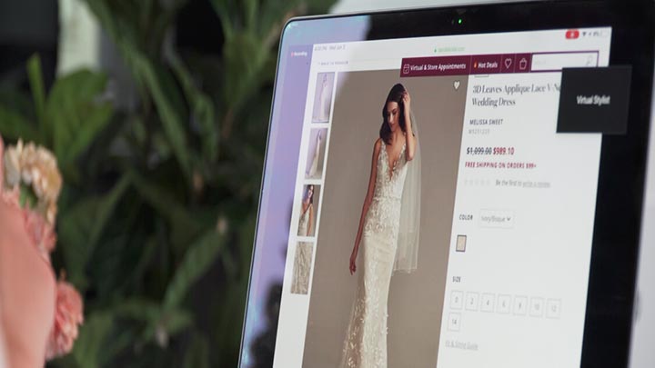 opened laptop showing a bride in a wedding dress on the screen