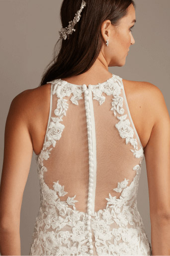 back of a bride wearing a lacy sheath wedding dress
