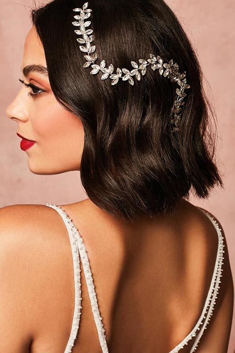 closeup of a bride wearing a large headpiece