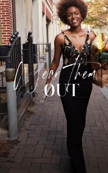 wear them out with woman wearing a black occasion dress holding groceries
