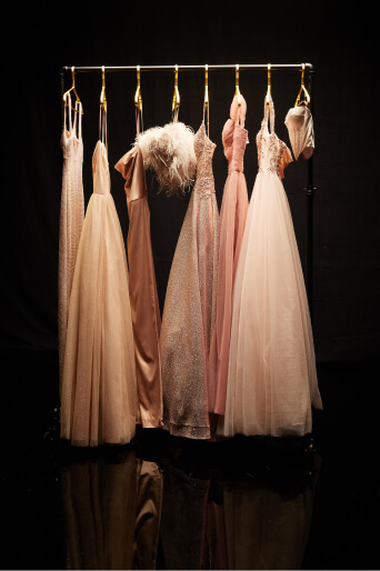 prom dresses hanging on a dress rack