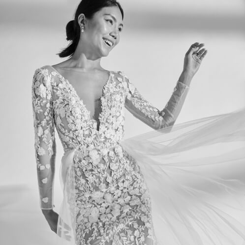woman in wedding dress laughing and smiling