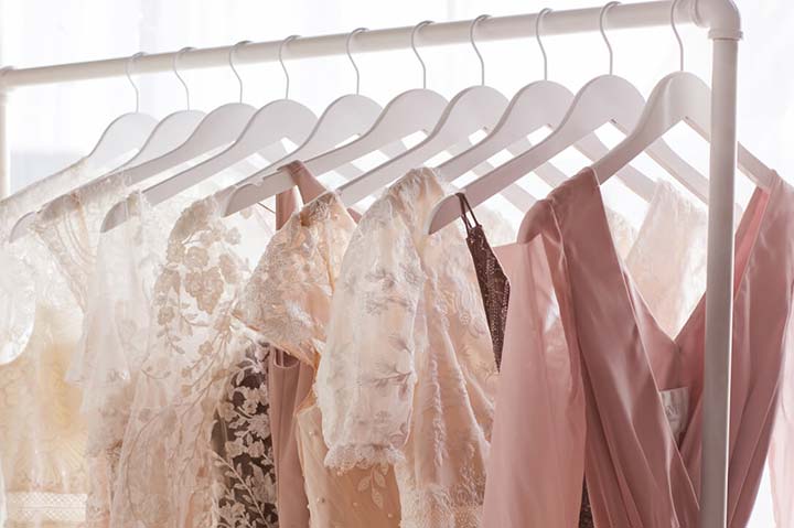 multiple dresses hanging on a dress rack