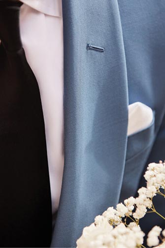 close up view of a blue tuxedo jacket