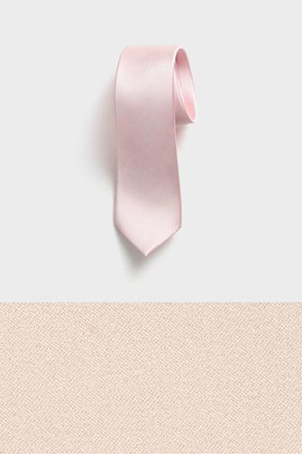 blush colored neck tie on top of a blush colored fabric swatch