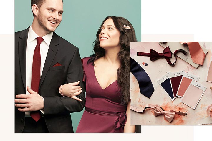 groomsman wearing a black tuxedo and red neck tie standing with a bridesmaid wearing a red dress with multiple colored fabric swatches next to them