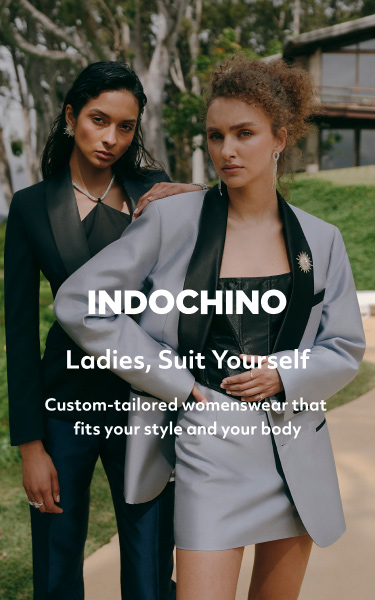 two women in suits standing by a pool promoting indochino ladies, suit yourself custom-tailored womenswear that fits your style and your body