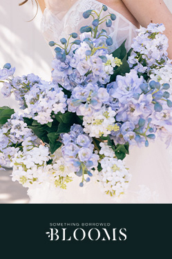 bride holding a purple flower bouquet promoting something borrowed blooms