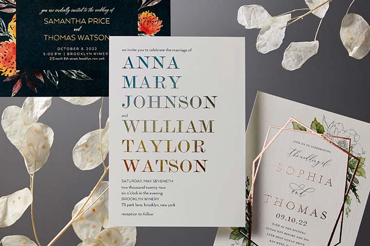 wedding invitations and white flowers
