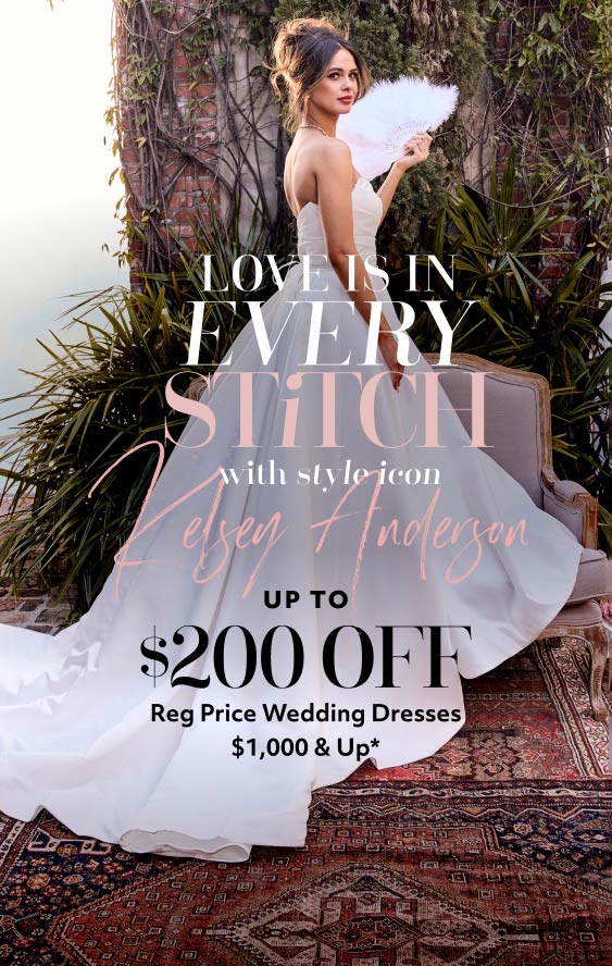 woman in wedding dress holding a feather fan promoting love is in every stitch with style icon kelsey anderson up to $200 off reg price wedding dresses $1,000 & up*