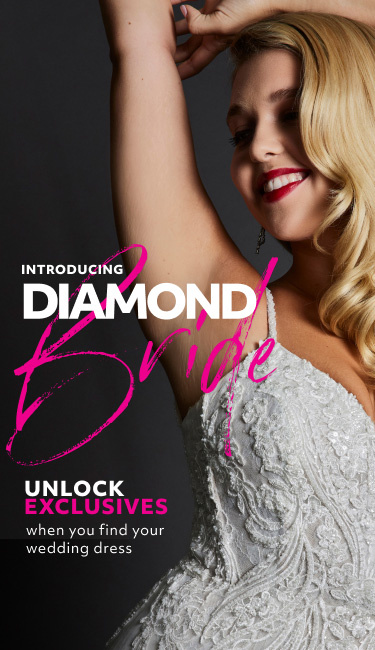 bride with her hands up abover her head promoting introducing diamond bride unlock exclusives when you find your wedding dress