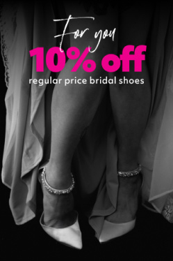 closeup of bride hiking up dress to show off shoes promoting for you 10% off regular price bridal shoes